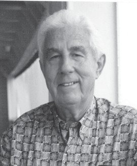 Ernest A. Myette, Willie Myette's father — a black-and-white portrait of an older man smiling, in a patterned shirt, beside a window